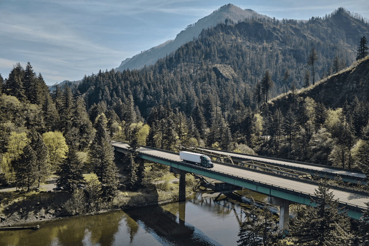 MVM Logistics truck crossing a bridge through the Pacific Northwest