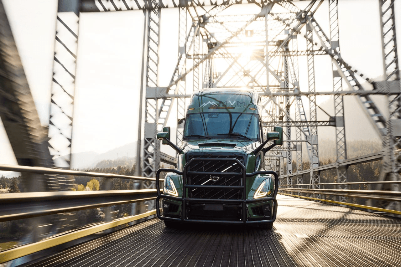 MVM Logistics Volvo truck crossing a Pacific Northwest bridge