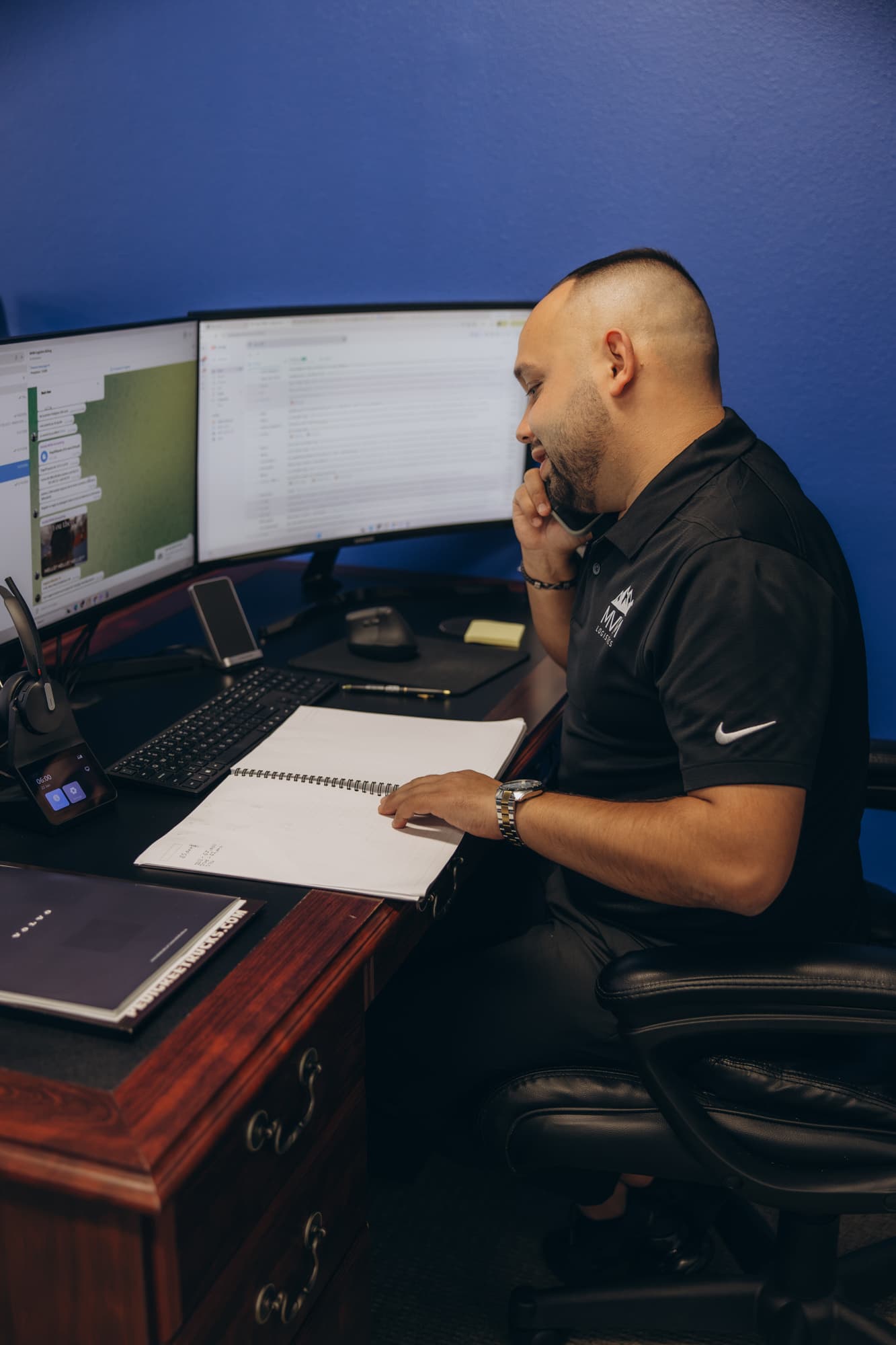 An account manager on a call with a broker