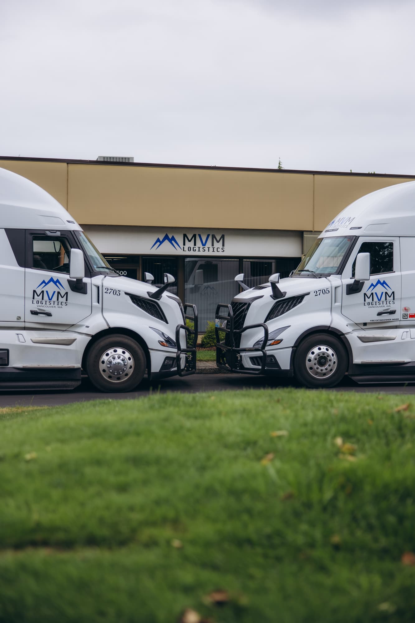 MVM Logistics trucks lined up outside the office